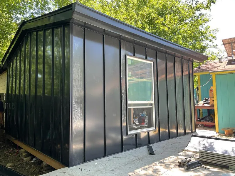 Black standing seam metal wall panels for Roof Inspection in Williams